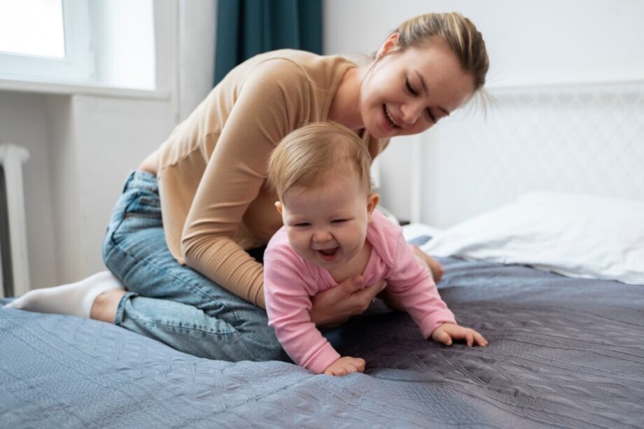 smiley-mother-holding-baby